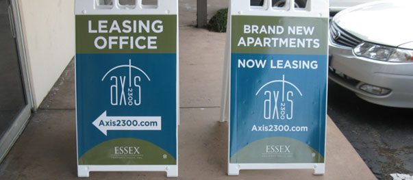 Double-sided A-frame sidewalk sign outside a business