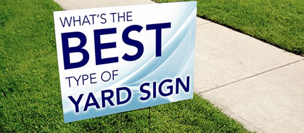Printed yard sign on metal stakes placed on a front lawn