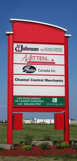 Tall free-standing pylon sign identifying a roadside business