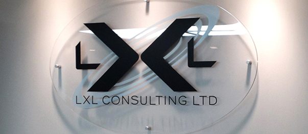 Large logo sign on a company lobby wall