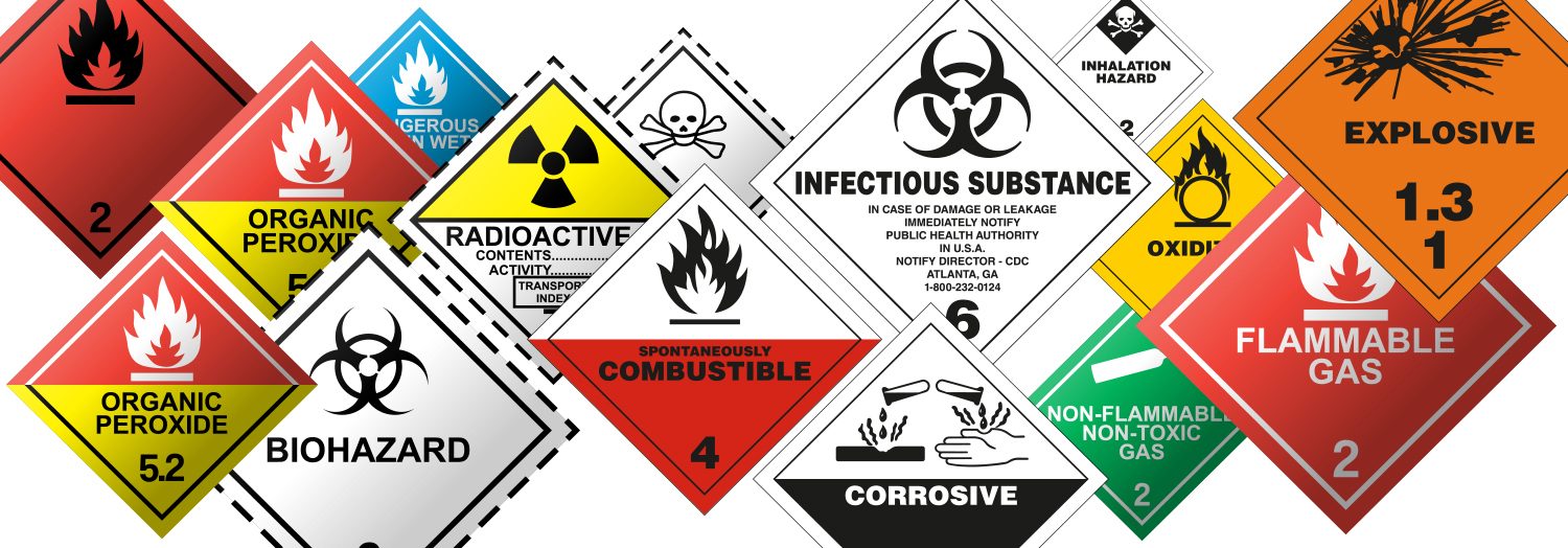 Dangerous goods placards showing hazard class symbols for flammable, toxic and corrosive materials