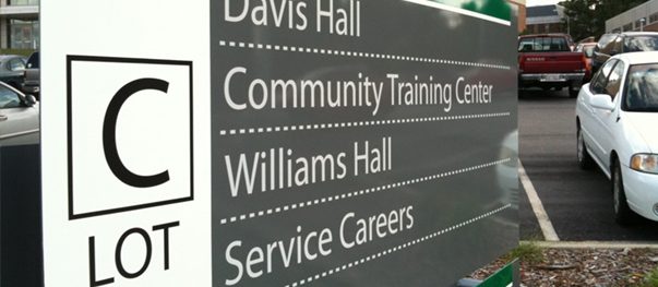 Interior wayfinding sign listing destinations inside an office